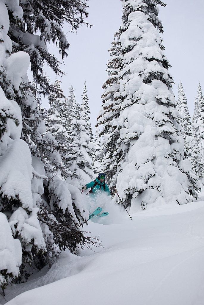 Jas Clancy, from Revelstoke Backcountry, skis happily in the backcountry.