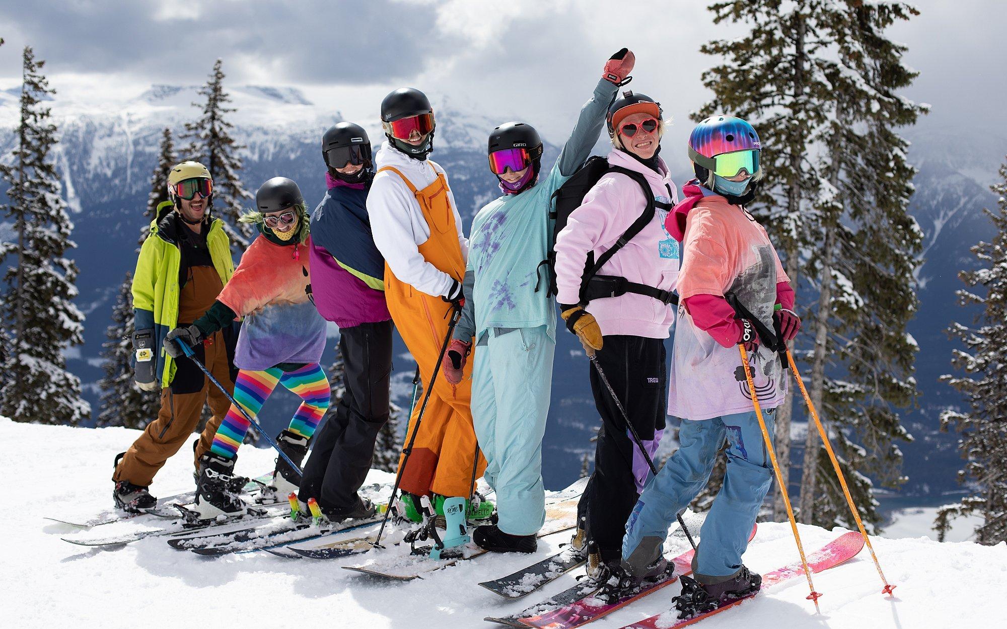 Skiers from 'People Like Us' smile for the camera.