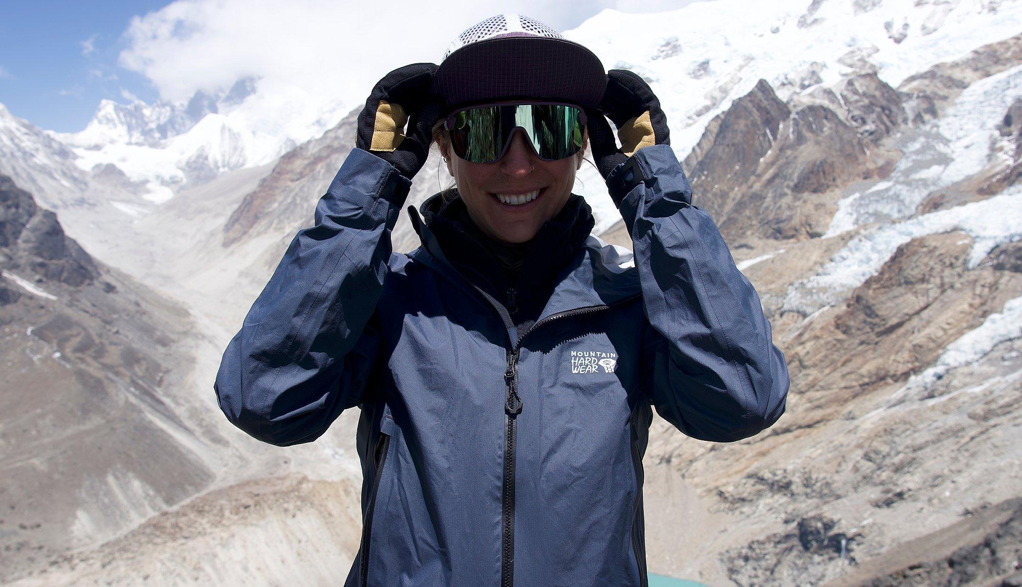 Shayna smiling in the mountains.