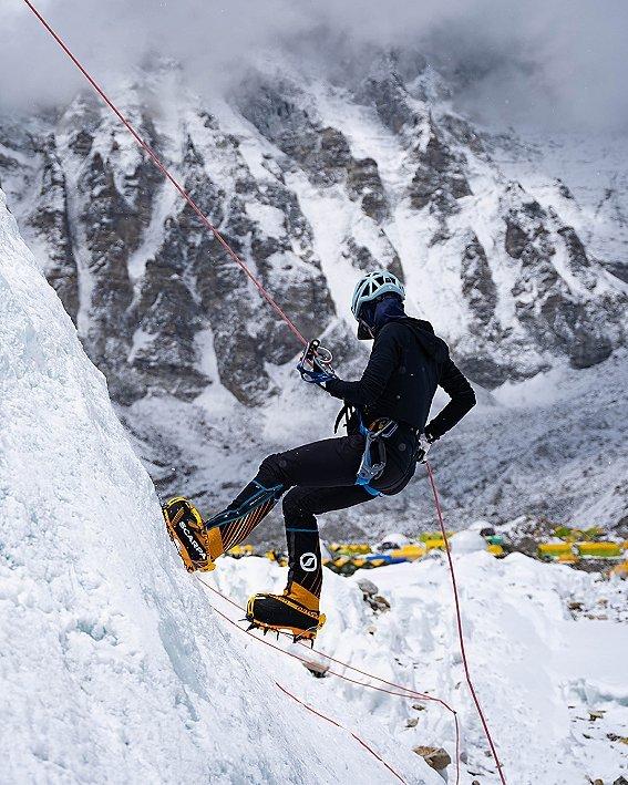 Shayna repelling while mountaineering.