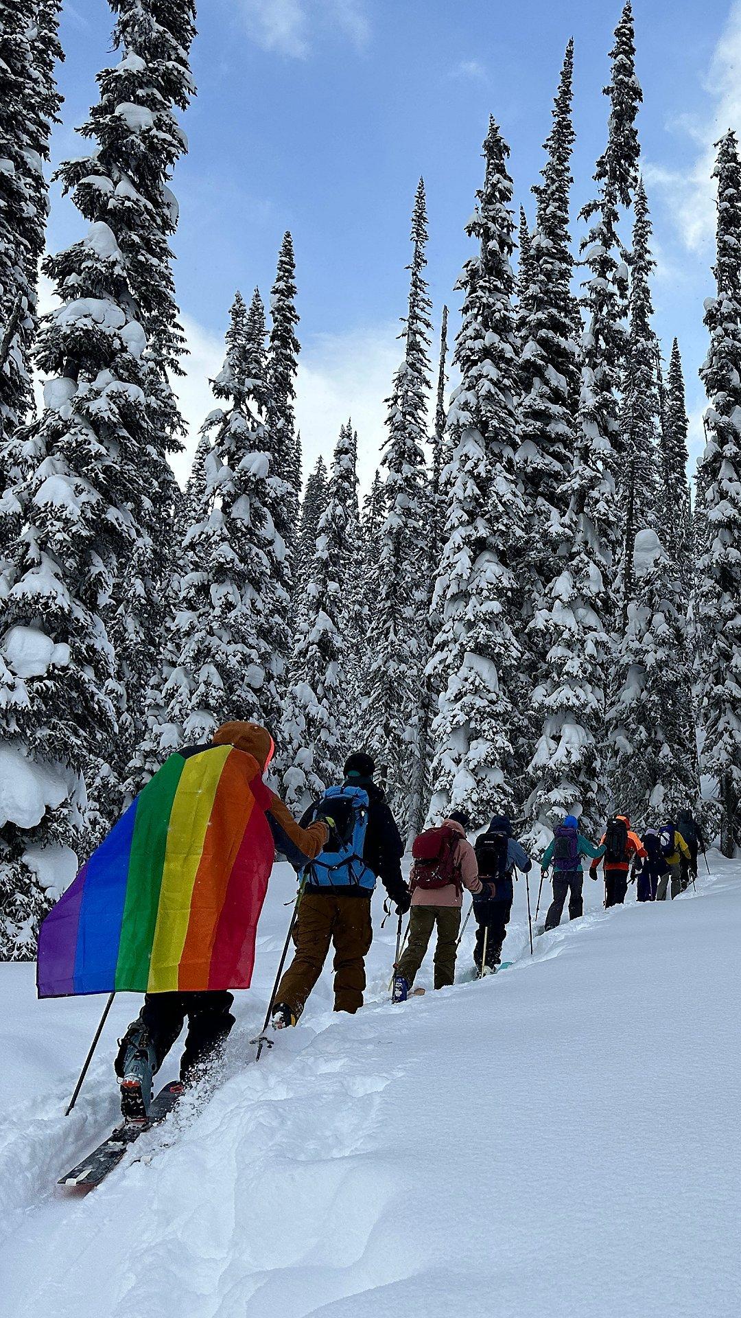 Open Mountains friends skin their way through the backcountry on skis. 