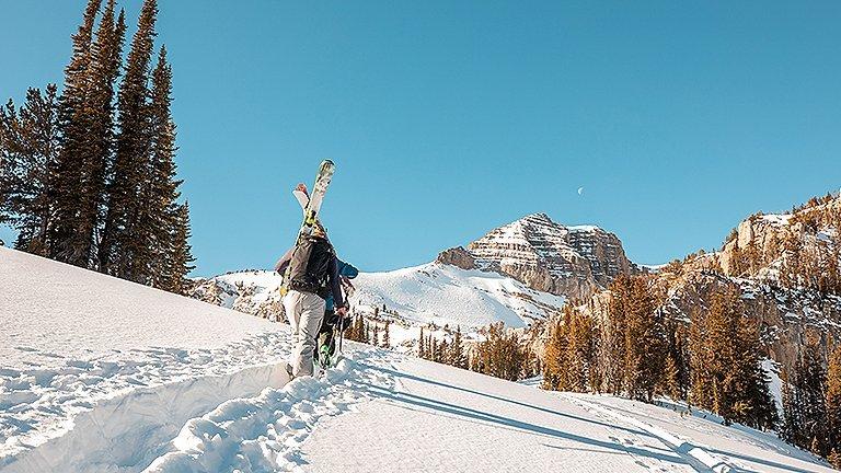 Skinning up in the backcountry on a bluebird day
