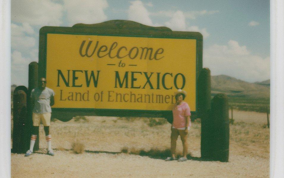 Benjamin and Frances Graham are pictured in a snapshot standing in front of a sign that reads “Missouri Information Center.”