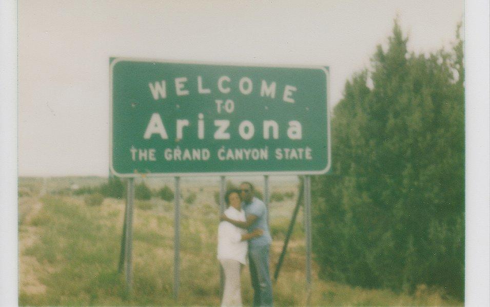 Benjamin and Frances Graham are pictured in a snapshot standing in front of a sign that reads “Missouri Information Center.”