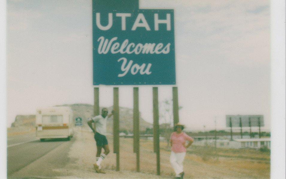 Benjamin and Frances Graham are pictured in a snapshot standing in front of a sign that reads “Missouri Information Center.”