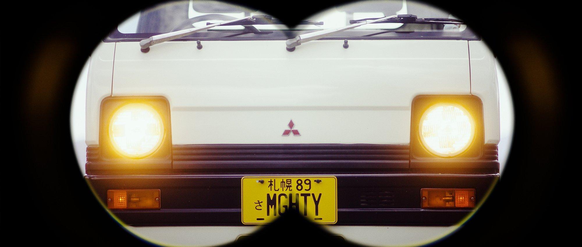 Mighty the Truck through binocular frames.