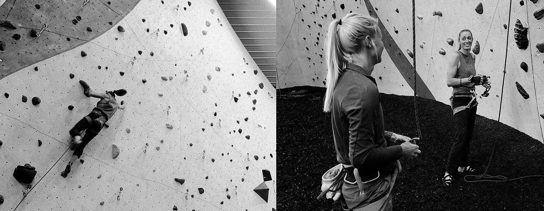 Two black and white images of Alex Johnson inside a climbing gym side by side; in the first one she is climbing up a route, in the second, she is smiling at her girlfriend.