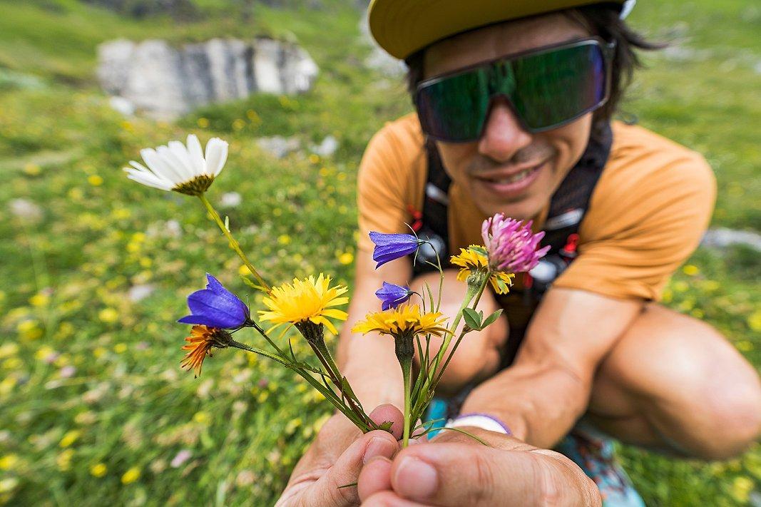 Matt showing wildflowers to the camera.