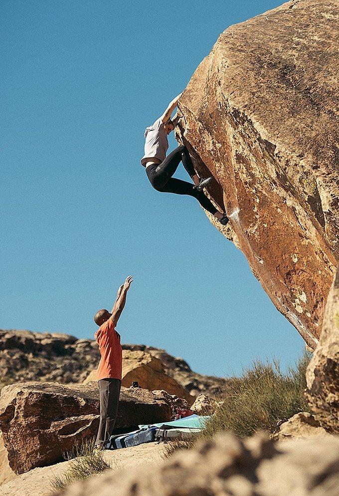 MHW Athlete Alex Johnson boulders in the Utah desert wearing the Women's All Day Favorite tight
