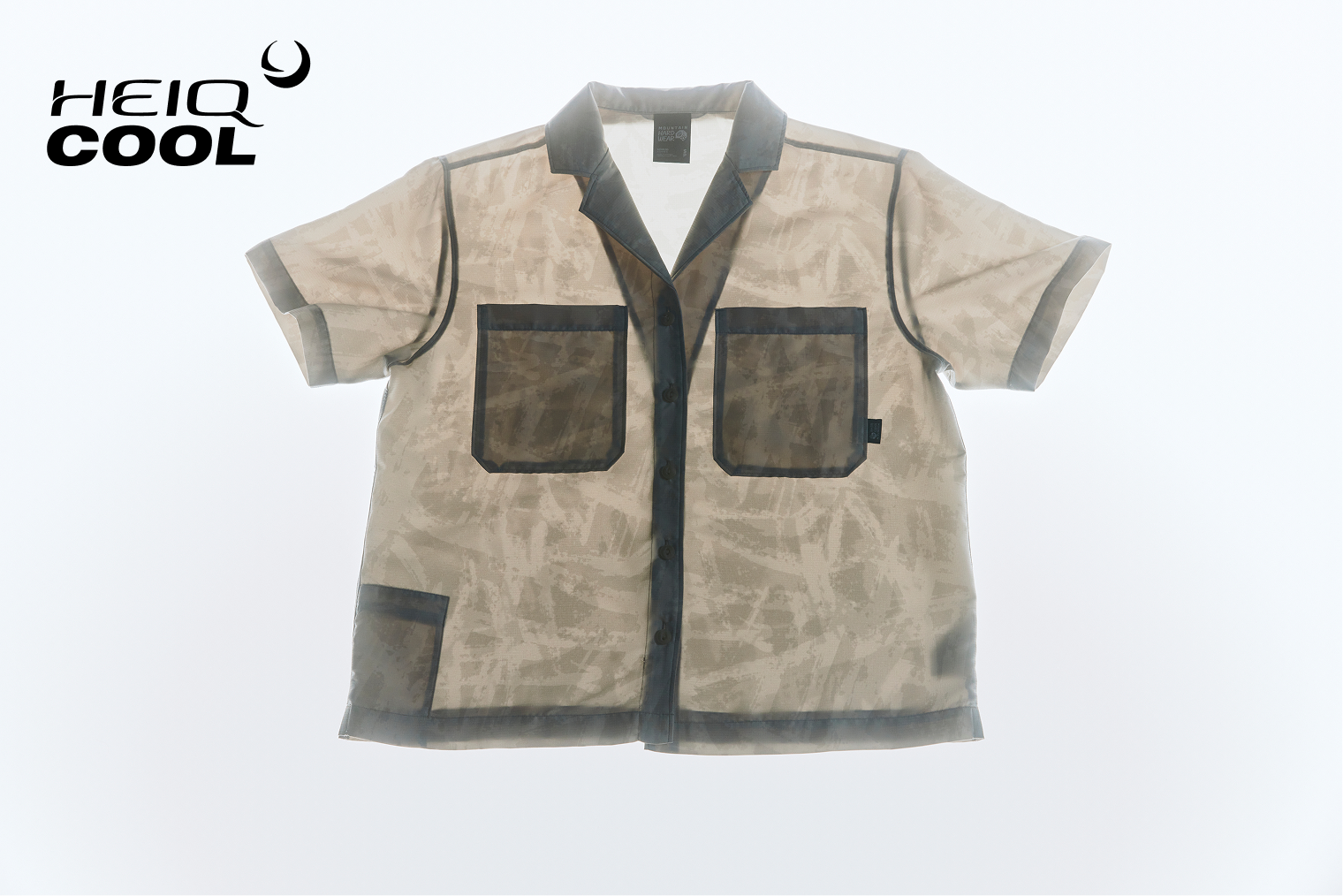 A Sun Drift™ Cooling Short Sleeve is photographed on a laid on a light table, the backlighting highlighting how light and airy the fabric is. On image icon reads: HeiQ Cool™.