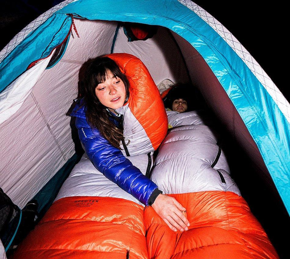 A camper in the ISPO winning Specter™ 15F Sleeping Bag