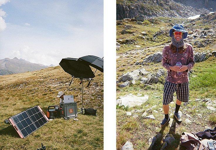 Behind the scenes of the Mountain Hardwear Go Broad Spectrum campaign shoot, powered largely by solar energy. Left: solar panels and gear set up in a high alpine meadow. Right: crew member in sun-protective clothing smiles between takes.