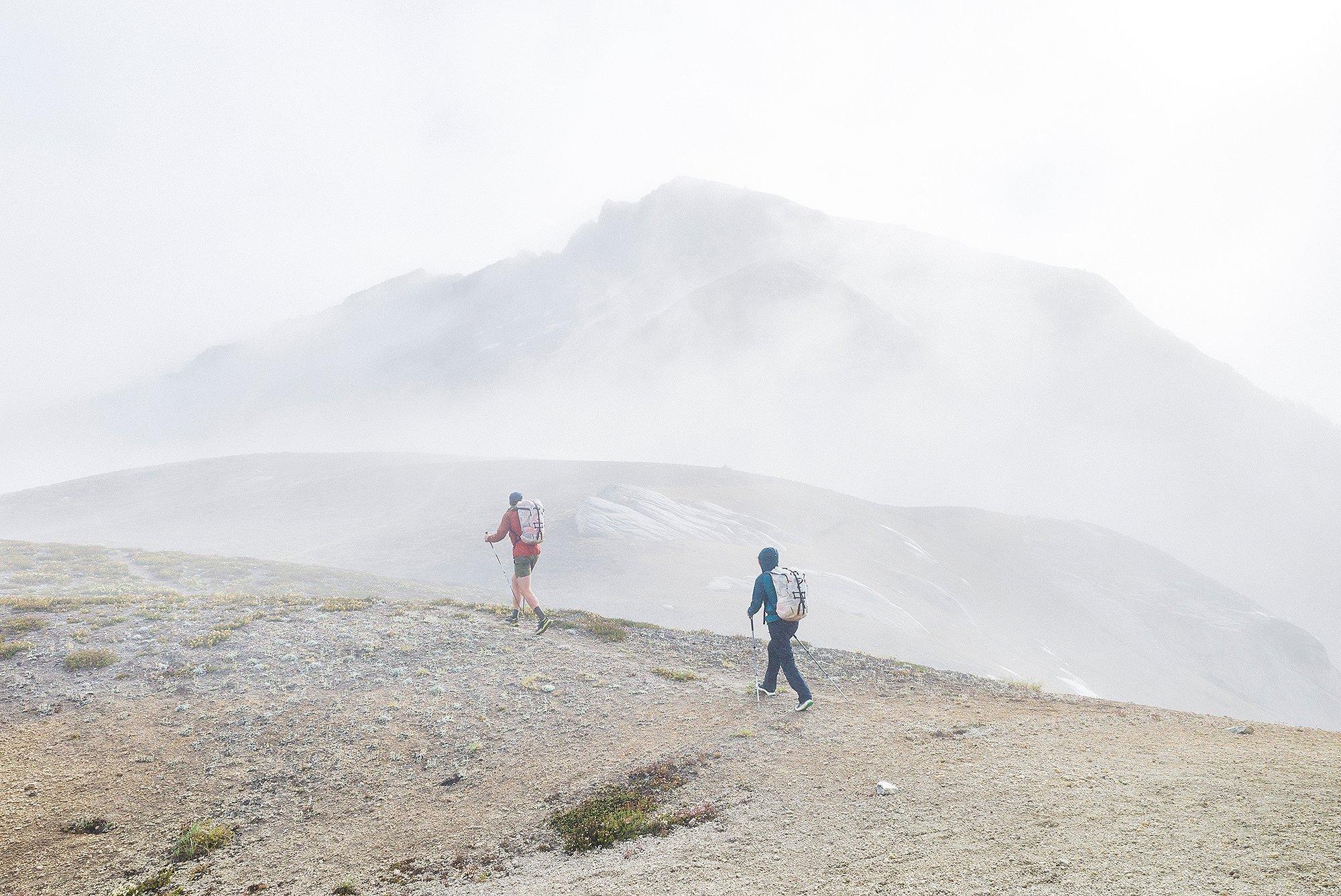 Hannah and CJ hike in the clouds.