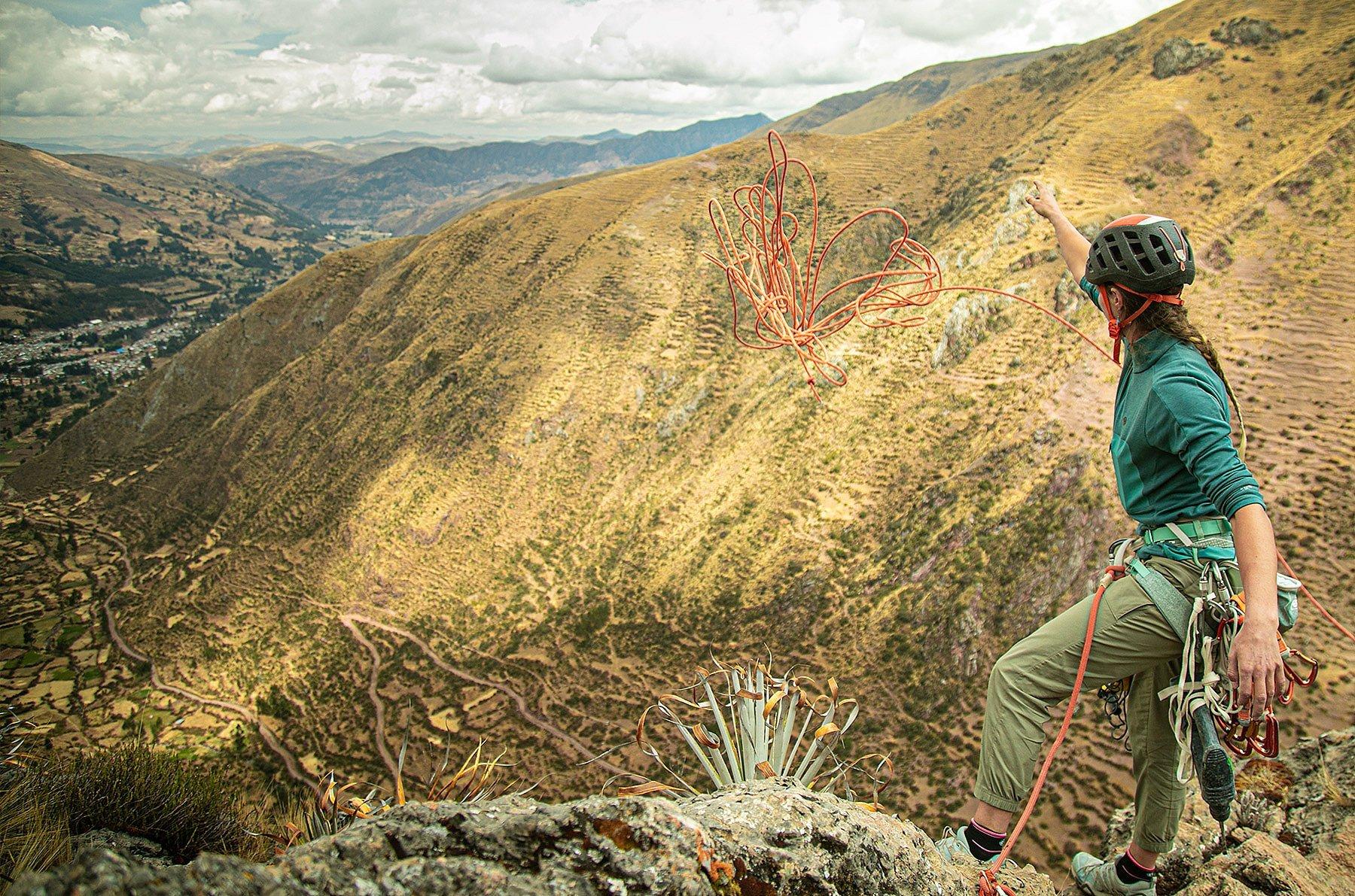 Charlotte at the top of the route, throws down the rope
