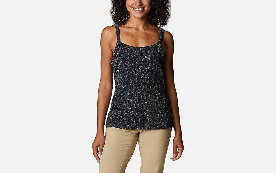 A product shot of a woman wearing a gray Columbia Sportswear Stanley Park tank top with a gray background.