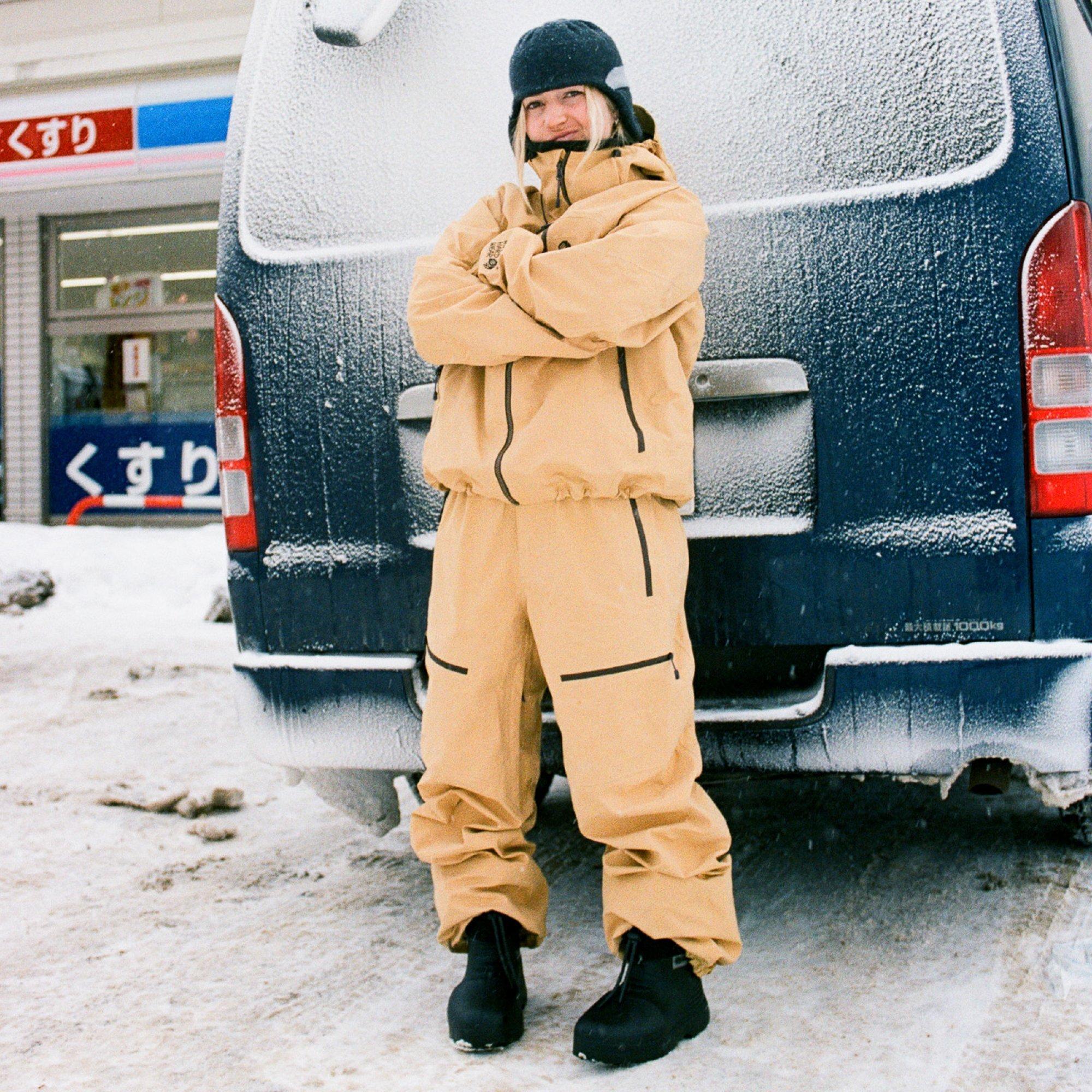 Professional skier Addison Rafford poses in behind a frosty van in front of a Japanese konbini during a snack stop.