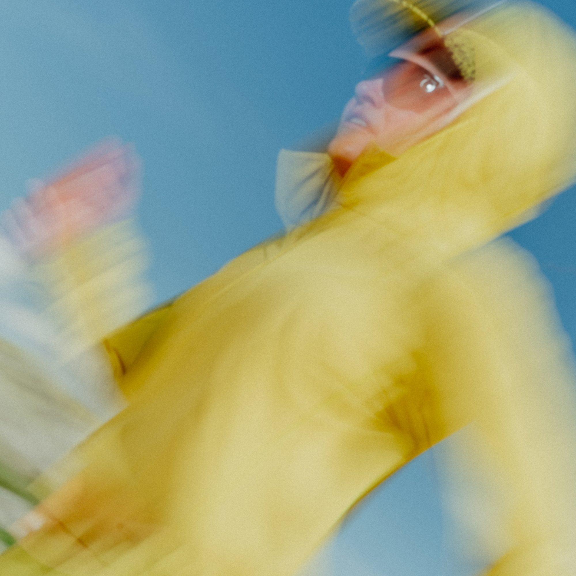 Stylized with artist blur, professional trail athlete Liz Derstine runs by.