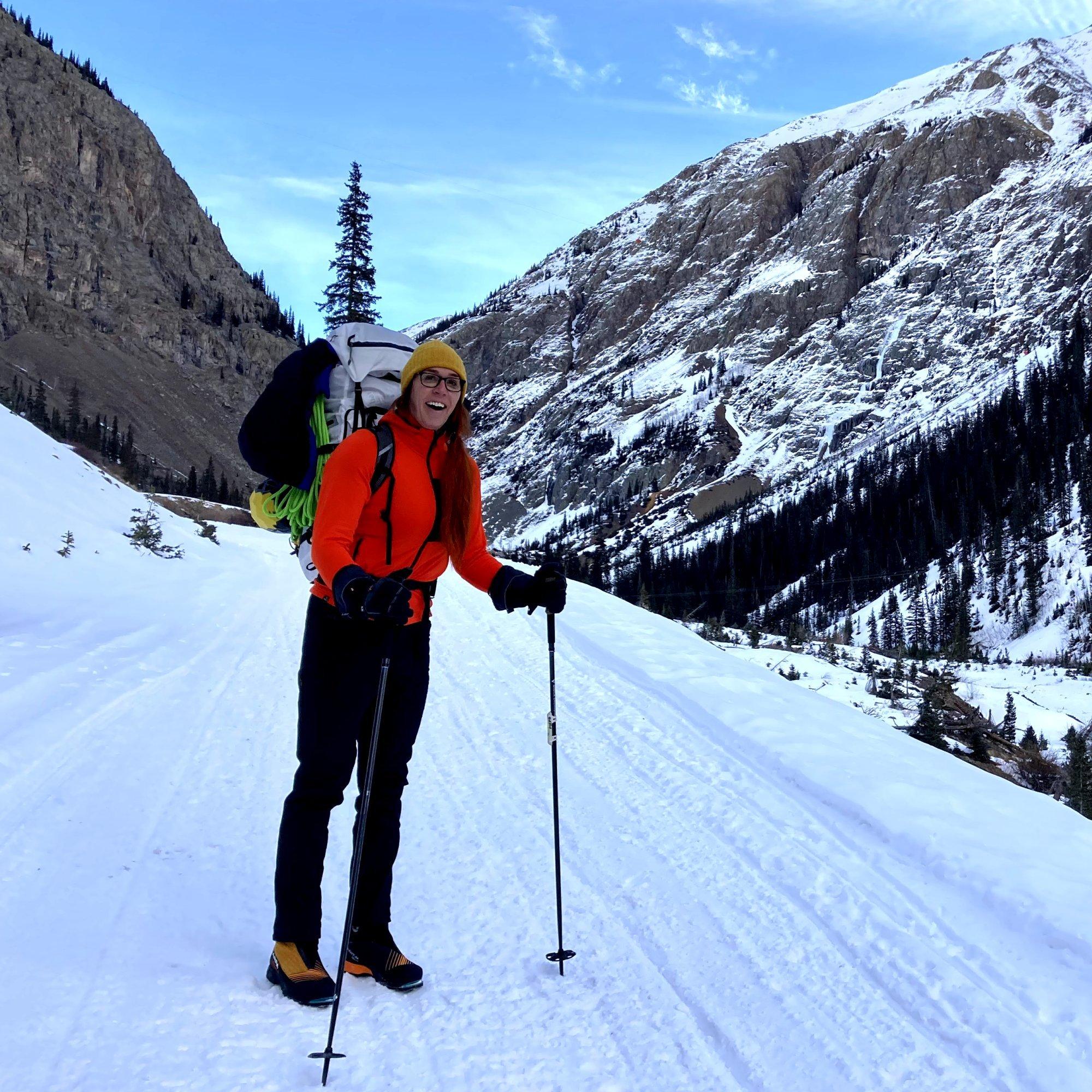 Poles in hand, her pack loaded with ropes and gear, professional climber Nikki Smith prepares for the snowy approach.