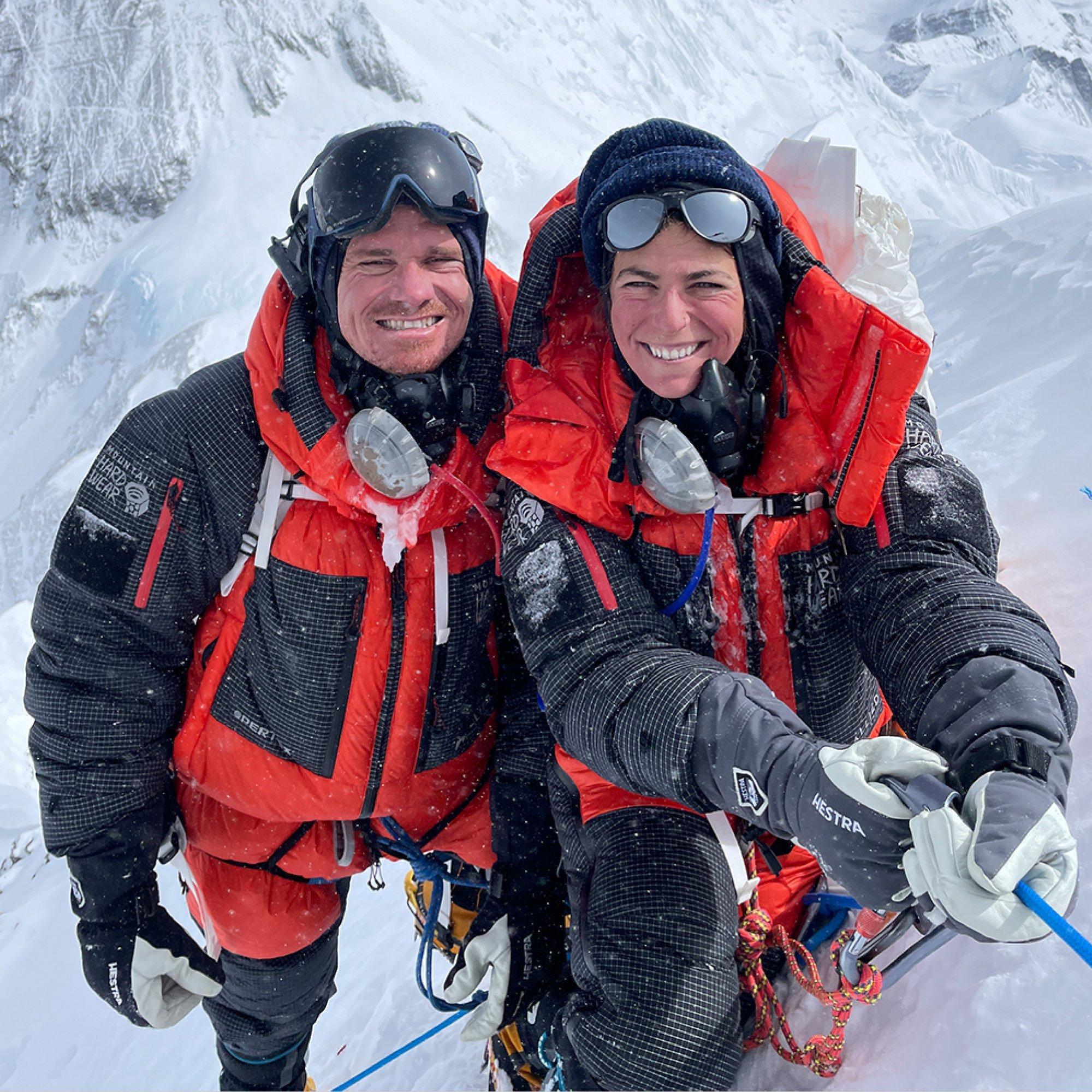 Professional deaf mountaineers Scott Lehmann and Shayna Unger pose together, oxygen masks freshly removed.