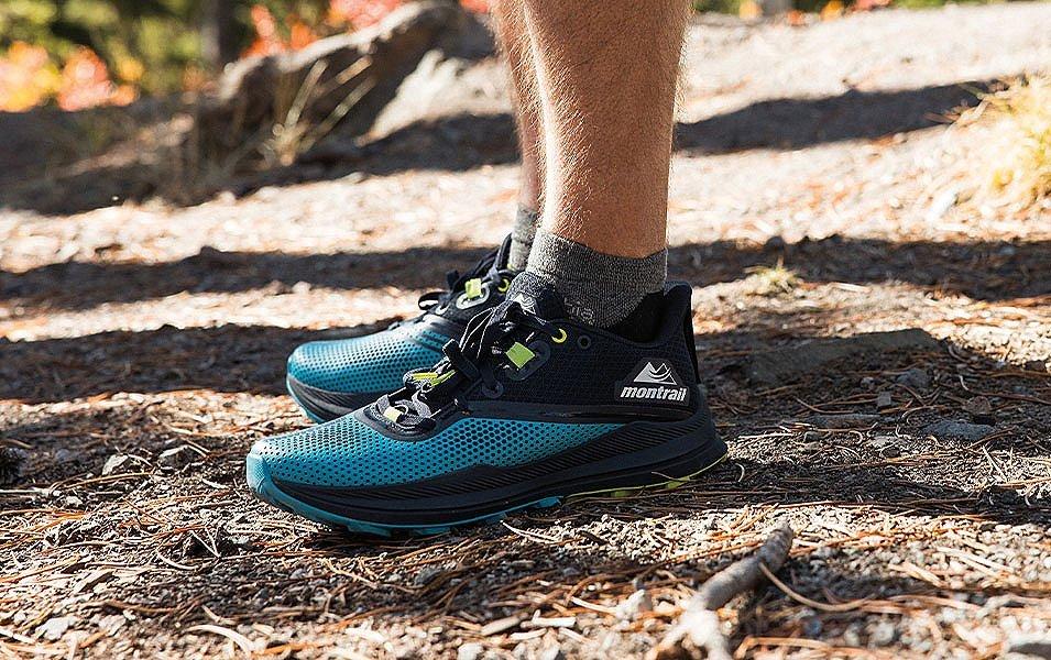  A close-up shot of a blue pair of Montrail trail running shoes. 