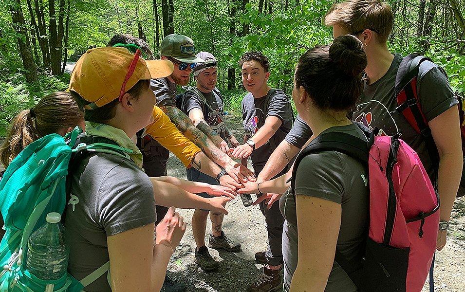 Group of hikers huddled together. 