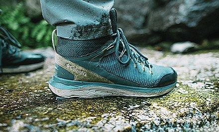 A hiker wearing a shoe with Navic Fit. 