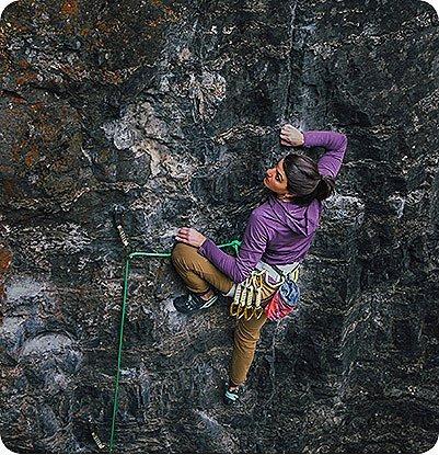 During 2021 Open Aperture photo clinic, Shara reaches for her next hold while lead climbing