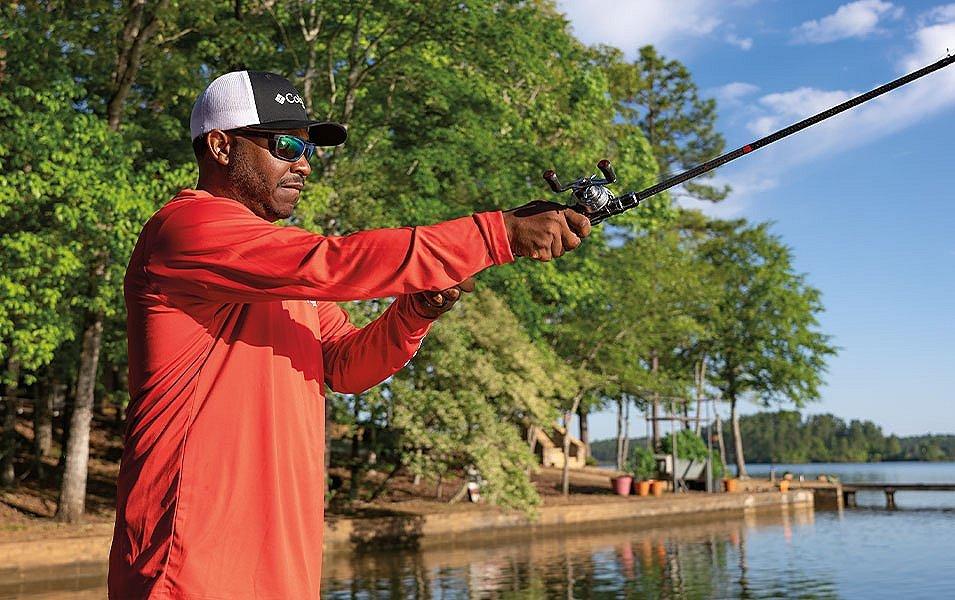 Pro angler Mark Daniels Jr. casts a fishing line into the water on a beautiful sunny day. 