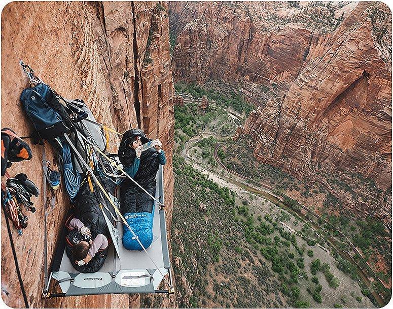 Ethan sleeping on a ledge in Zion, while on a multi-pitch climb trip