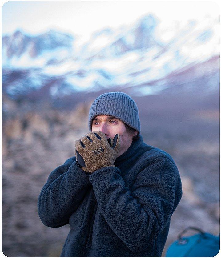 Ethan warming up his hands in the Utah cold