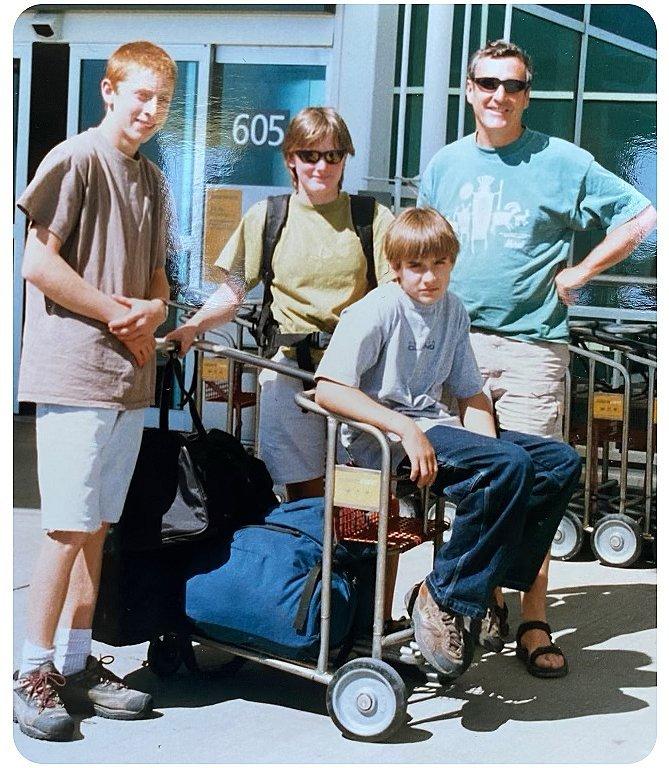 Ethan with his family at the airport while traveling