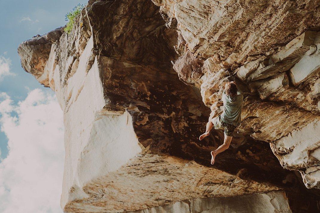 Parker Reed climbing left off of Rat Race (12a) 