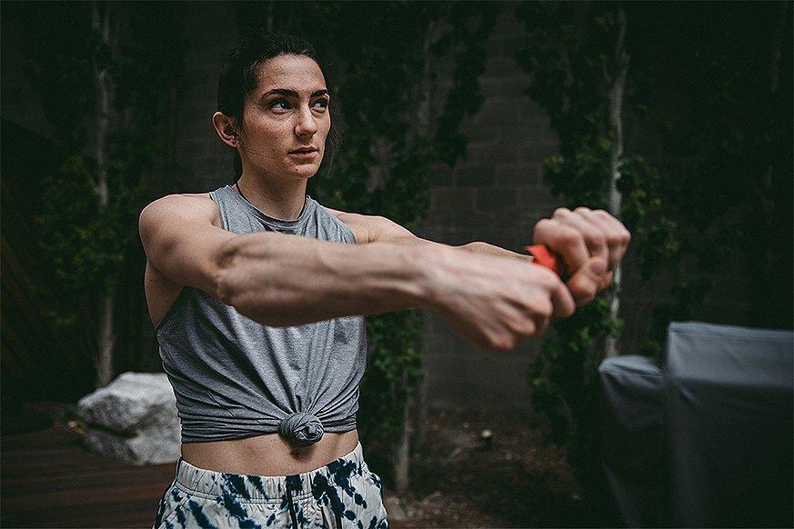Kyra stretching in the gym
