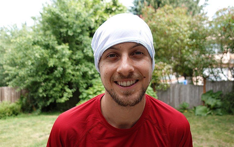Man wearing neck gaiter. 
