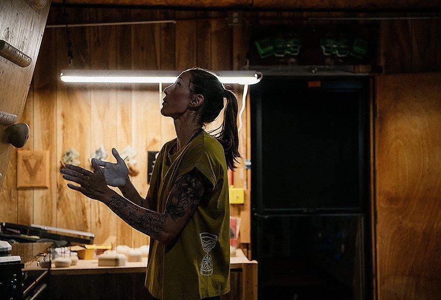 Alex chalking up, getting ready for her next workout