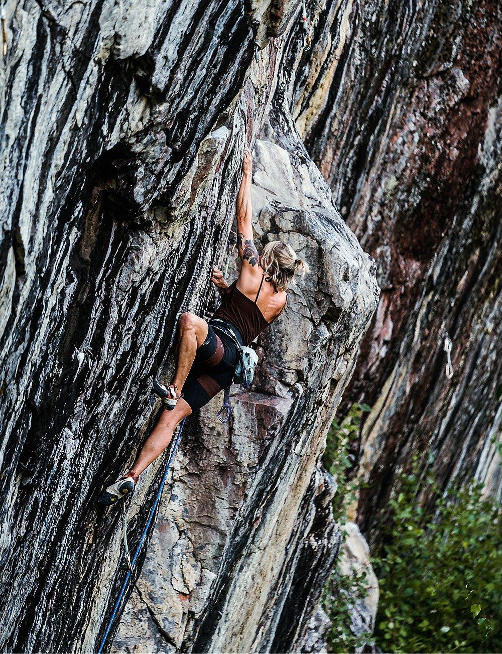 Anna climbing some especially stripey rock in Finland.