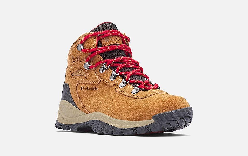 A product shot of Columbia Sportswear’s Newton Ridge Plus II hiking boots set against a white background. 
