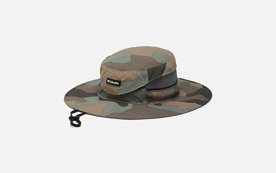  A product shot of a camo-colored Columbia Sportswear booney hat set against a white background.

