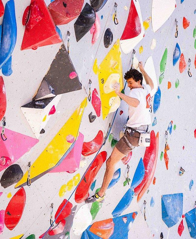 Jesse Grupper climbing in the gym.