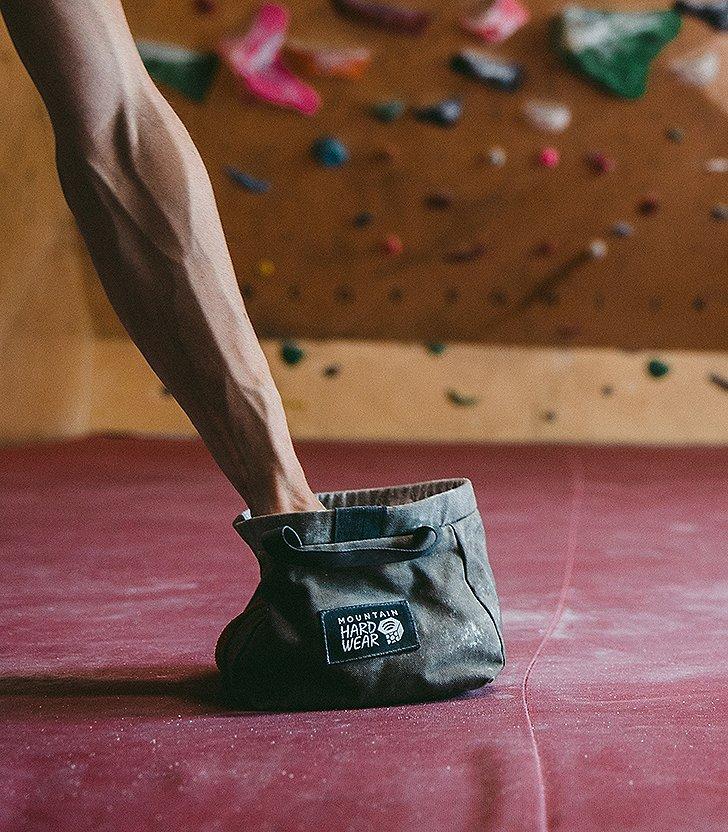 Reaching in the chalk bag
