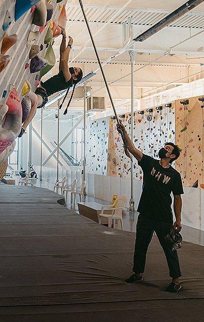 Josh showing Kyra her next hold with a long pointer