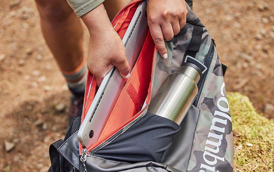 Close up of a Columbia backpack being opened. 