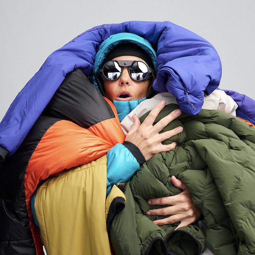 Studio shot of lots of insulation jackets piled on.