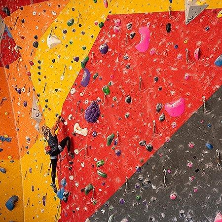 MHW athlete Anna Liina Laitinen climbing inside a gym.