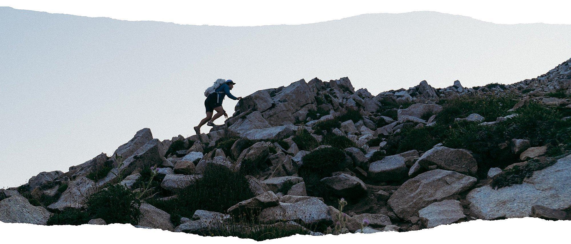 MHW Athlete Ted Hesser trail running in the high alpine.