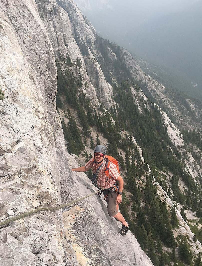 ACMG participant climbing on a rockface
