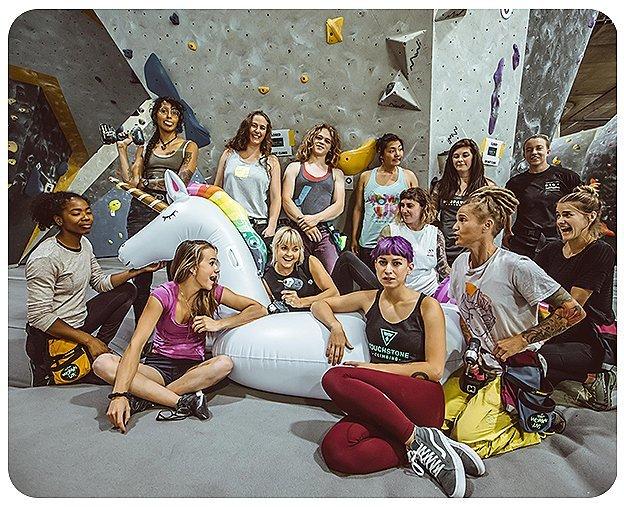 A group of participants from the 2019 Woman Up event smile for the camera.