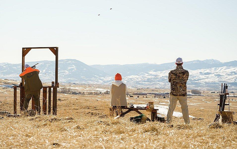 People skeet shooting. 