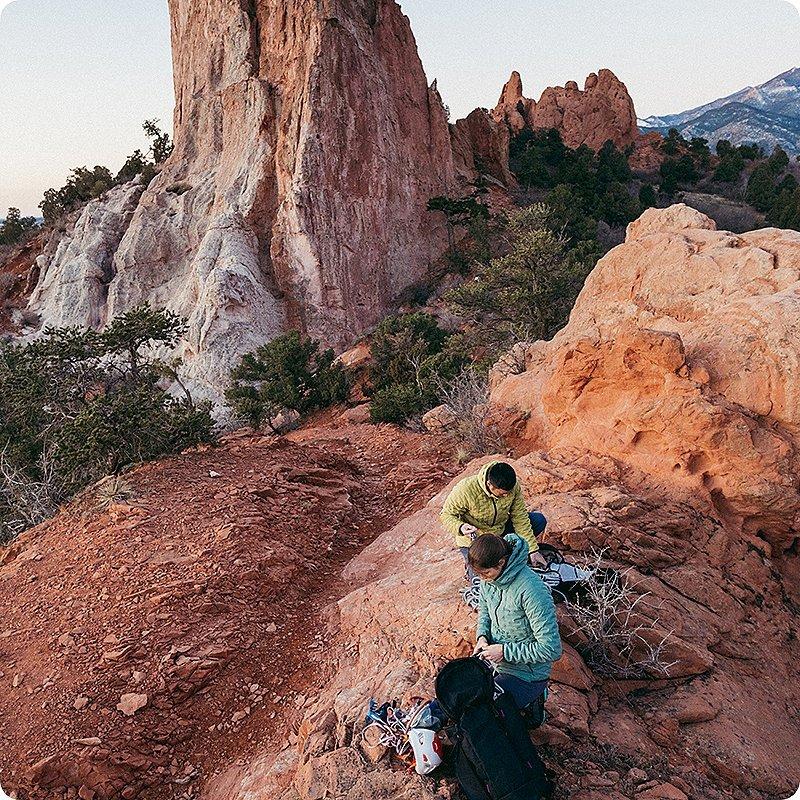 Two climbers getting ready for their next climb at the base
