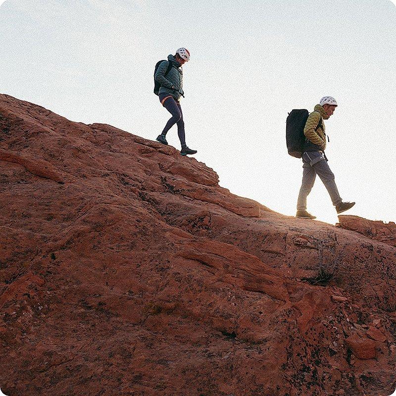 Two climbers walking on the approach